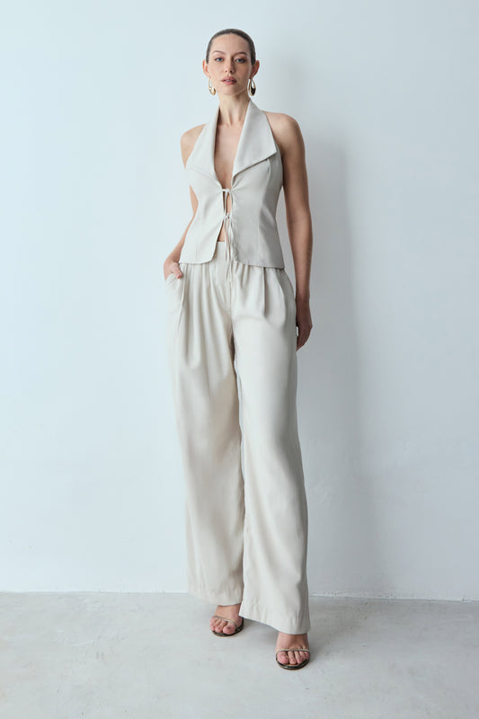 CALCA RETA COM ELASTICO NA CINTURA E BOLSO COSTAS AREIA