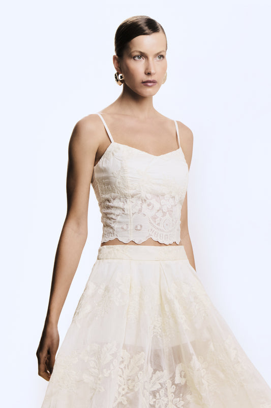 CROPPED DE ALCA RECORTE V BUSTO BARRA ASSIMETRICA CREME