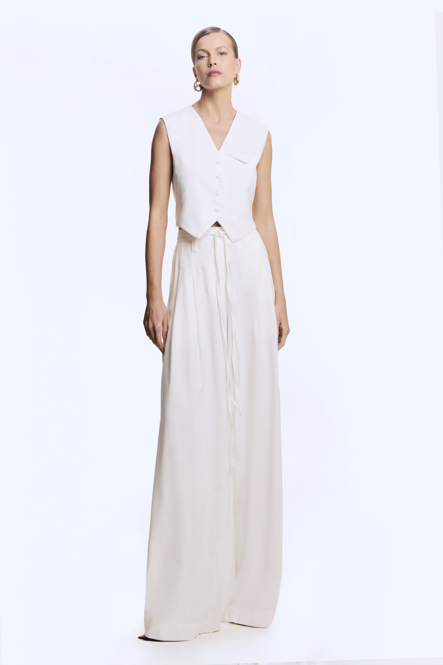 BLUSA SEM MANGA BARRA ASSIMETRICA FIVELA COSTAS OFF WHITE